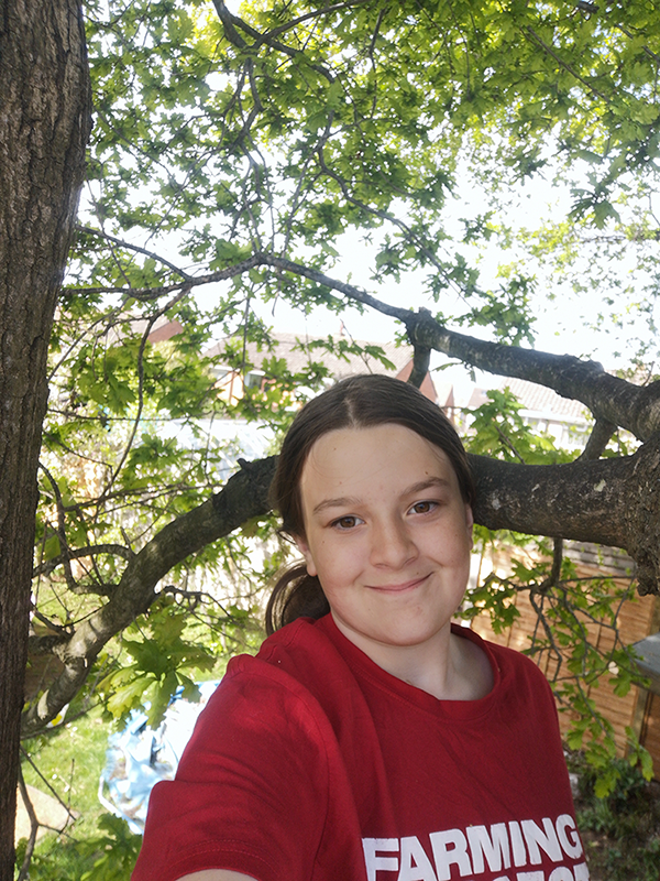Ruby with trees and nature behind her