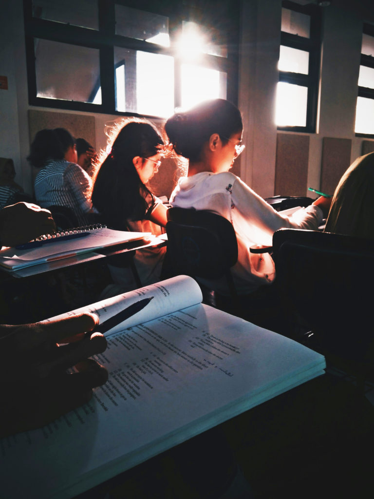 Young people sit an exam