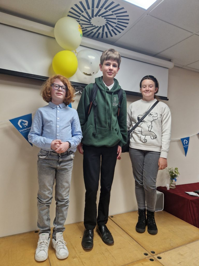 Noah, James and Ruby standing in a row